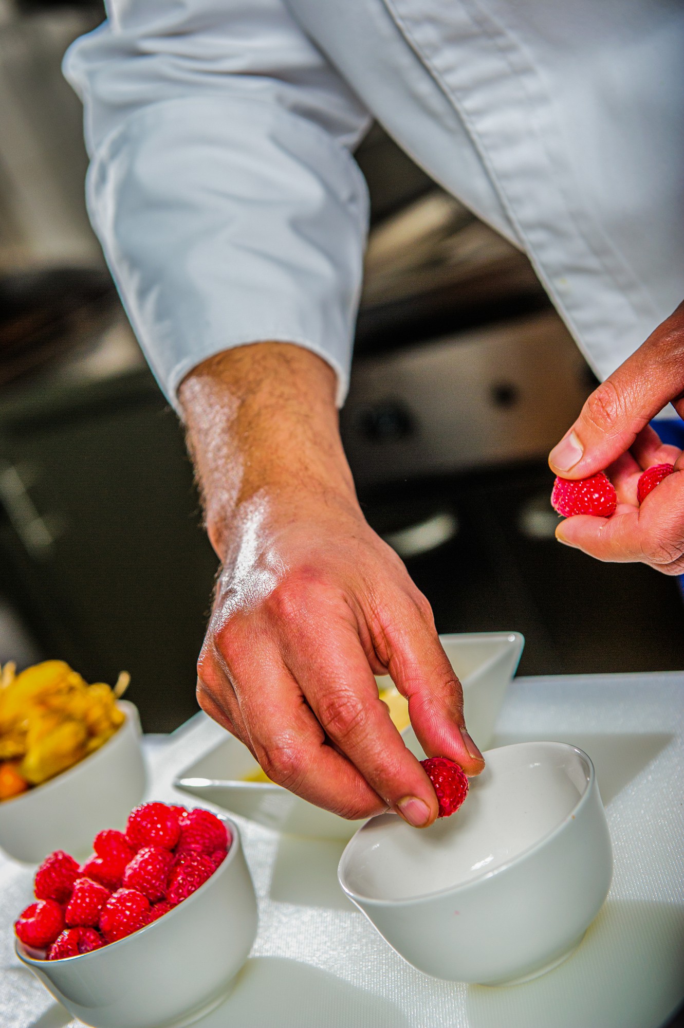 chef demonstrating plating technique